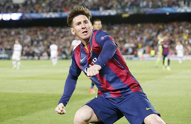 Barcelona's Lionel Messi celebrates scoring their first goal