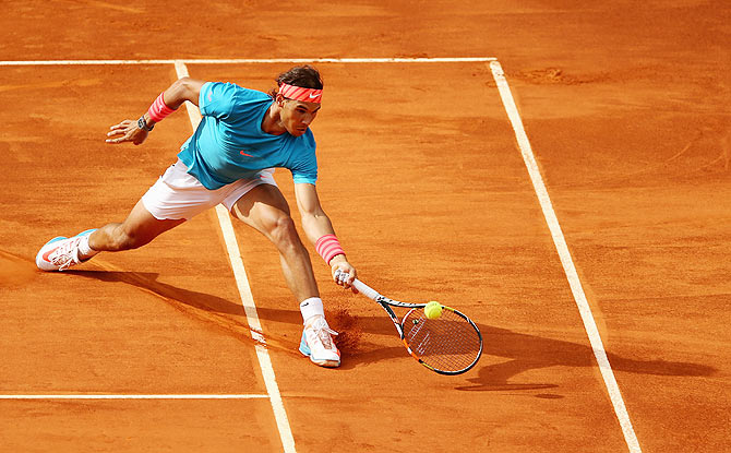 Spain's Rafael Nadal plays a forehand volley against USA's Steve Johnson in their second round match on Wednesday