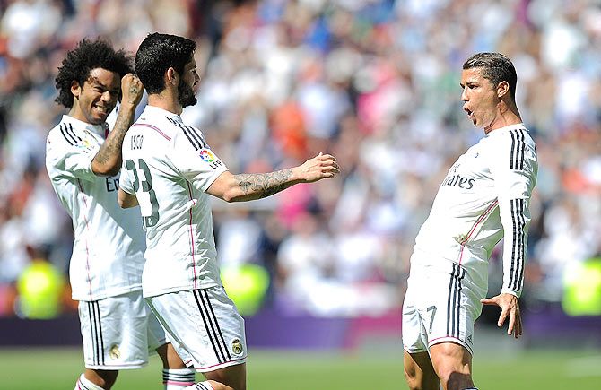 Cristiano Ronaldo of Real Madrid celebrates with Isco and Marcelo after scoring 