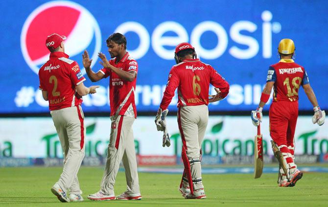 Sandeep Sharma of Kings XI Punjab celebrates the wicket of Royal Challengers Bangalore captain Virat Kohli