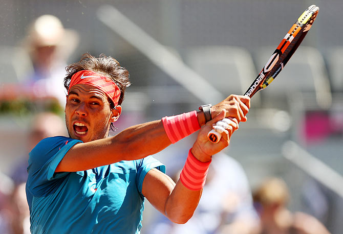 Rafael Nadal of Spain in action during his straight set victory against Simone Bolelli of Italy in their third round match of the Madrid Open tennis tournament at the Caja Magica in Madrid on Thursday