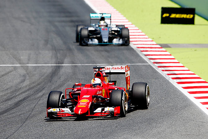 Sebastian Vettel of Germany and Ferrari leads Lewis Hamilton of Great Britain and Mercedes GP during the Spanish Formula One Grand Prix at Circuit de Catalunya in Montmelo on Sunday