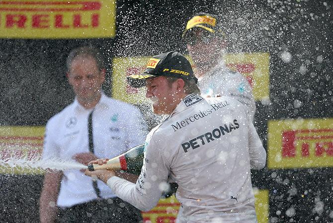 Mercedes GP's German driver Nico Rosberg celebrates on the podium after winning the Spanish Formula One Grand Prix at Circuit de Catalunya in Montmelo, Spain, on May 10