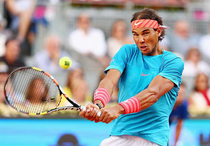 Rafael Nadal of Spain plays a backhand against Andy Murray of Great Britain in the Madrid Masters Open final on Sunday