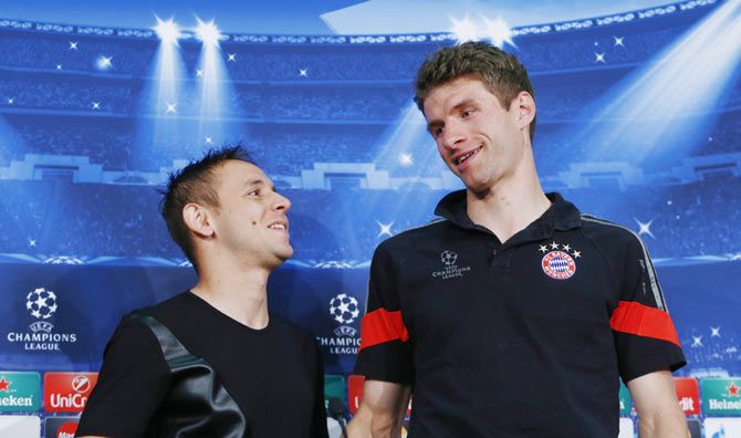 Bayern Munich's Rafinha and Thomas Muller during the press conference