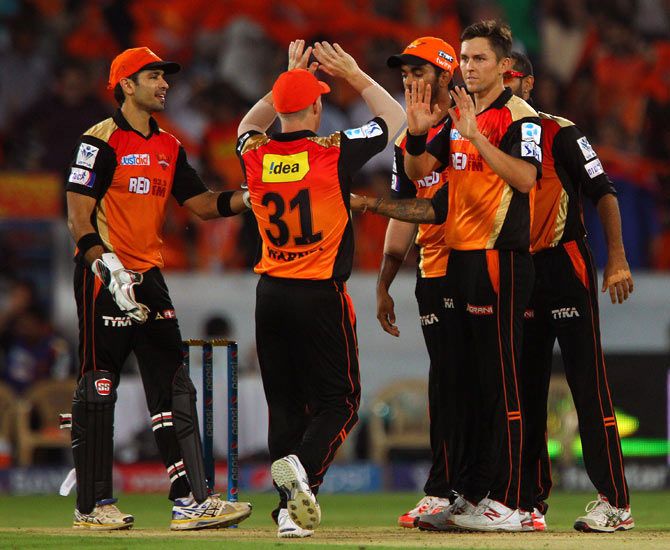 Sunrisers Hyderabad's Trent Boult (right) celebrates with team after taking the wicket of Glenn Maxwell