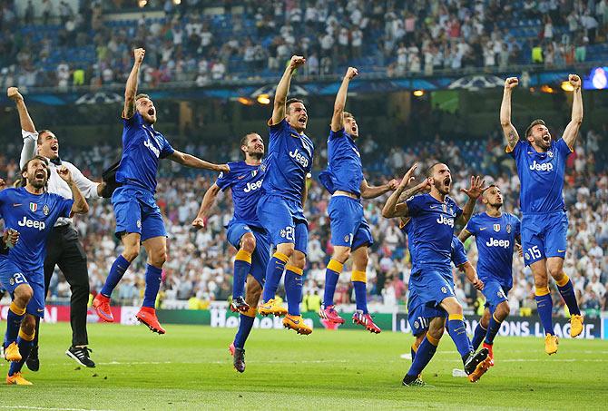 Juventus players celebrate following their progression to the final during the UEFA Champions League semi-final second leg match against Real Madrid at Estadio Santiago Bernabeu on Wednesday