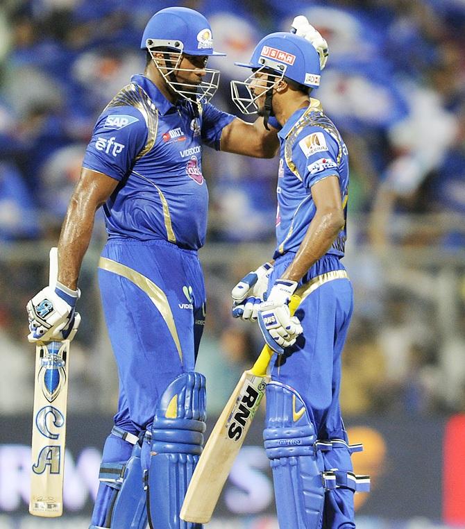 Kieron Pollard of Mumbai Indians congratulates teammate Hardik Pandya