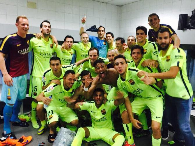 Barcelona players celebrate in the dressing room