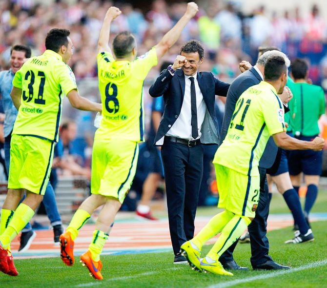 Luis Enrique manager of Barcelona celebrates with players