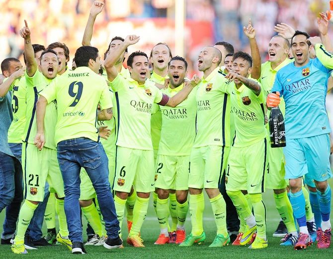 FC Barcelona players celebrate after winning the La Liga title