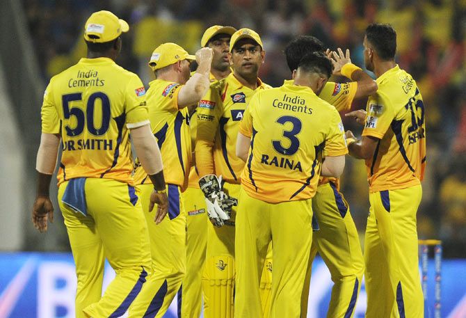 Chennai Super Kings players celebrate a wicket