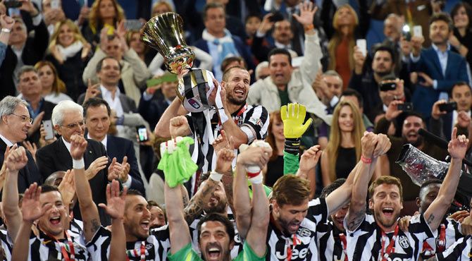 Juventus captain Giorgio Chiellini lifts the Italian Cup after defeating SS Lazio in the final at Olimpico Stadium in Rome on Wednesday