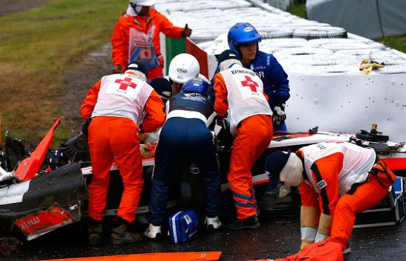 Jules Bianchi of France and Marussia receives urgent medical treatment after crashing during the Japanese Formula One Grand Prix at Suzuka Circuit in October 2014