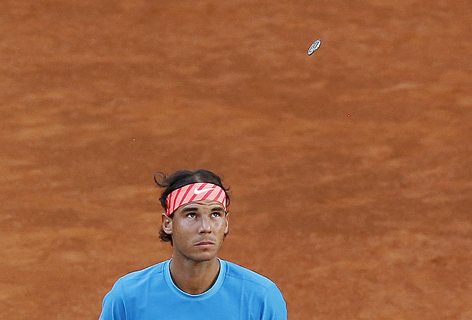 Spain's Rafael Nadal looks up during the coin toss before the match