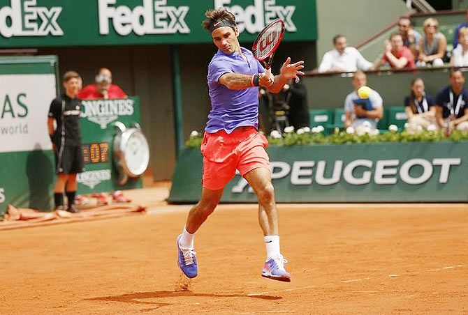 Switzerland's Roger Federer in action against Colombian Alejandro Falla during the men's singles first round match of the French Open 