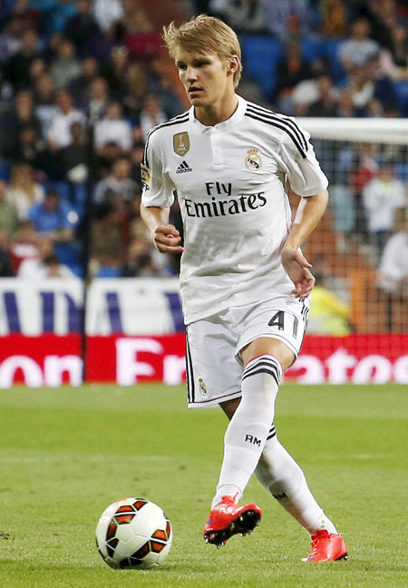 Real Madrid's Martin Odegaard controls the ball during their La Liga match against Getafe at Santiago Bernabeu stadium in Madrid on Saturday