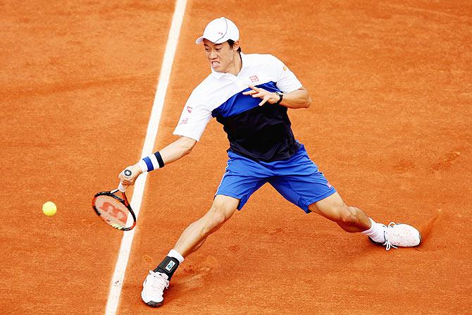 Japan's Kei Nishikori plays a forehand in his match against Frenchman Paul-Henri Mathieu