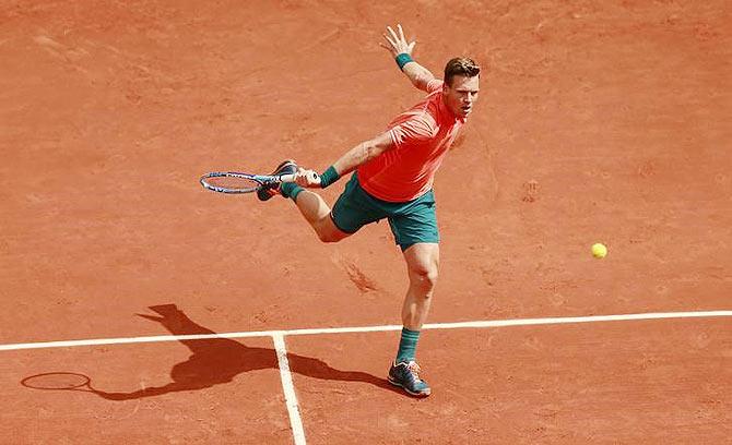 Czech Republic's Tomas Berdych in action Japan's Yoshihito Nishioka during their French Open men's singles first round match at Roland Garros on Monday