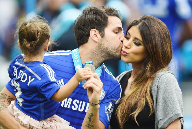 Cesc Fabregas of Chelsea kisses his girlfriend Daniella Semaan after the Barclays Premier League match between Chelsea and Sunderland at Stamford Bridge on Sunday