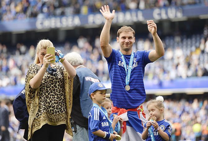 Chelsea's Branislav Ivanovic waves to the fans besides his family