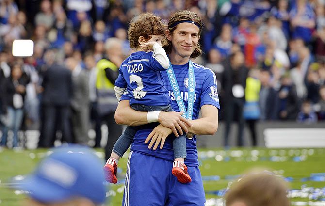 Chelsea's Filipe Luis celebrates with his kid