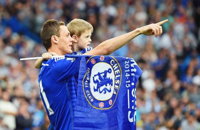 Nemanja Matic of Chelsea with his child