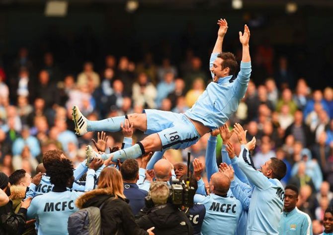  Manchester City's Frank Lampard is tossed by his teammates after their English Premier League match against Southampton at Etihad Stadium in Manchester on Sunday. It was the English midfielder's final EPL match
