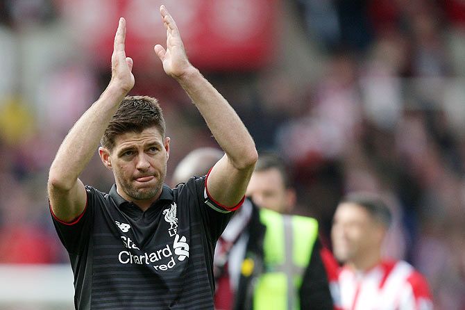 Liverpool's Steven Gerrard applauds the fans after their English Premier League match against Stoke City at Britannia Stadium in Stoke on Trent on Sunday