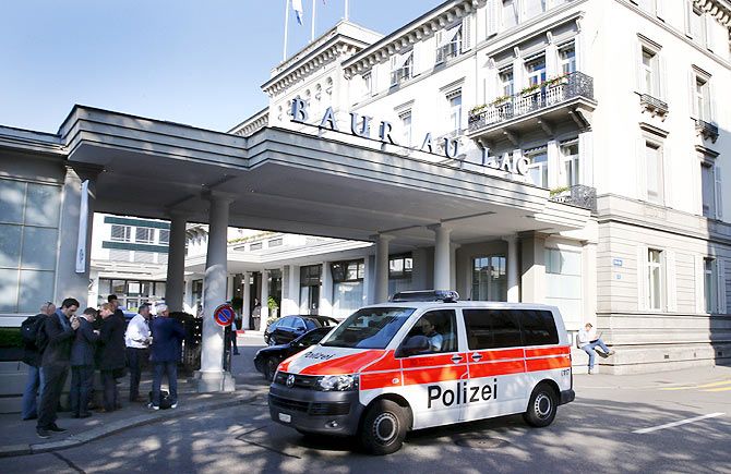 A police van drives past the Baur au Lac hotel in Zurich, Switzerland on Wednesday. Photograph: Arnd Wiegmann/Reuters