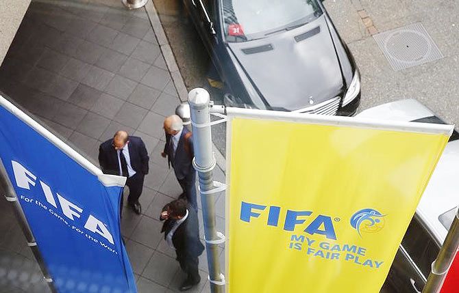 FIFA flags are pictured outside the Marritot hotel, where a meeting of the Confederation of African Football (CAF) was held in Zurich, Switzerland, on Wednesday