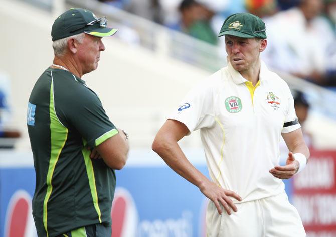 Peter Siddle of Australia speaks to Craig McDermott