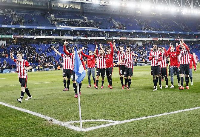 Athletic Bilbao players celebrate defeating Espanyol during their semi-final second leg Spanish King's Cup trophy match, near Barcelona on March 4