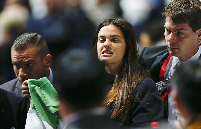 Security officers block a pro-Palestine protestor at the 65th FIFA Congress in Zurich on Friday