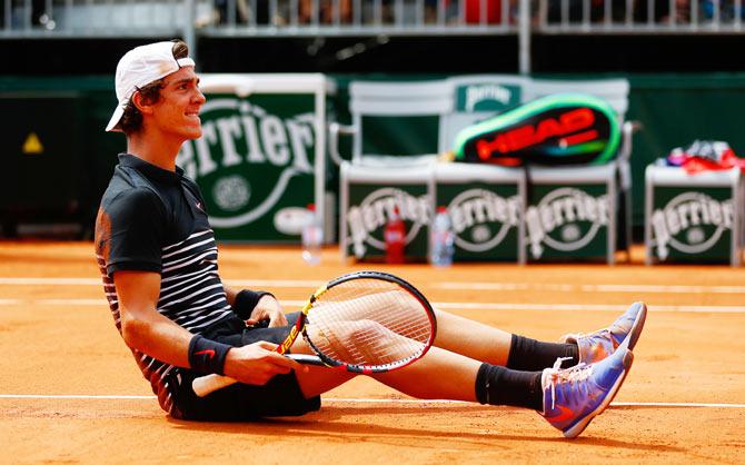 Australia's Thanasi Kokkinakis celebrates match point against compatriot Bernard Tomic