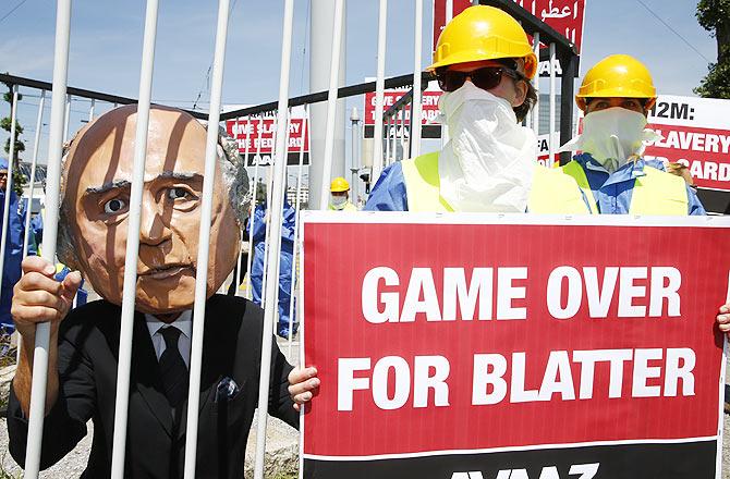 Activists from advocacy group Avaaz demonstrate near the Hallenstadion, in Zurich