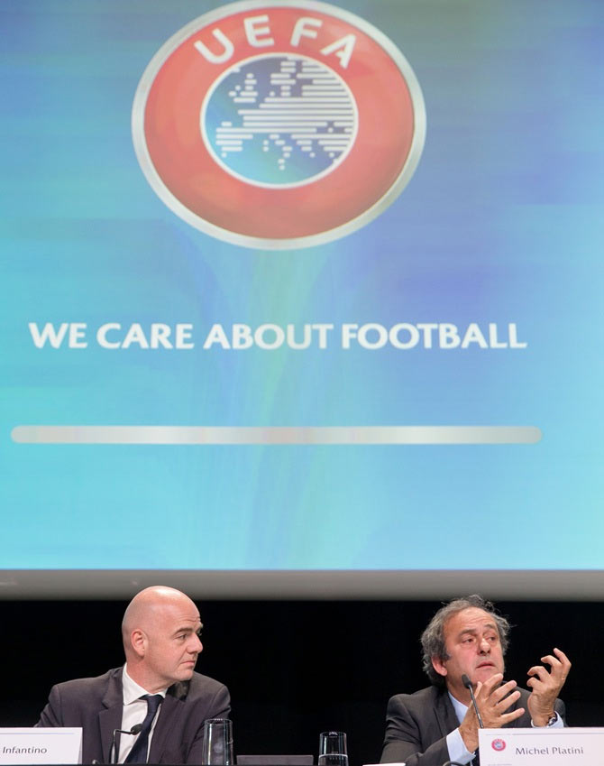 UEFA General Secretary Gianni Infantino, left, and UEFA president Michel Platini attend a press conference prior to the 65th FIFA Congress in Zurich
