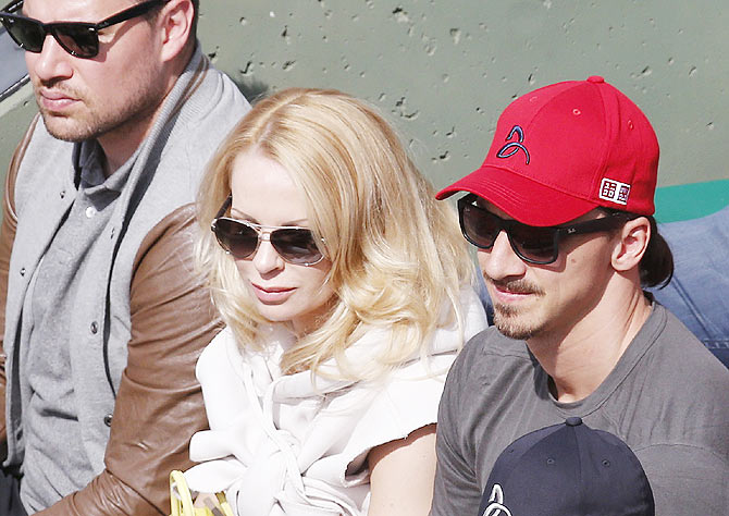 Paris St Germain's Zlatan Ibrahimovic (right) and his wife Helena Seger watch Novak Djokovic in action against Gilles Muller