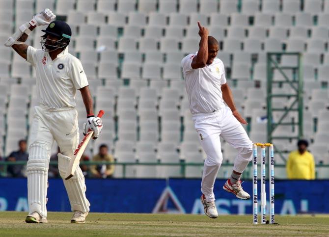 Vernon Philander (right) celebrates the wicket of Shikhar Dhawan