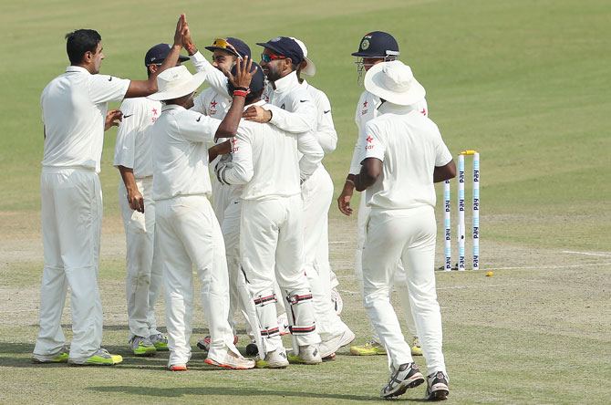 ndian players celebrate the wicket of South African captain Hashim Amla 