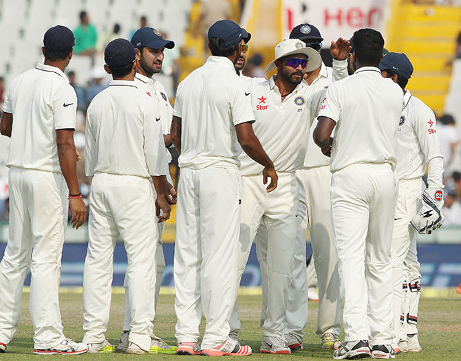 Indian players celebrate the fall of a South African wicket 