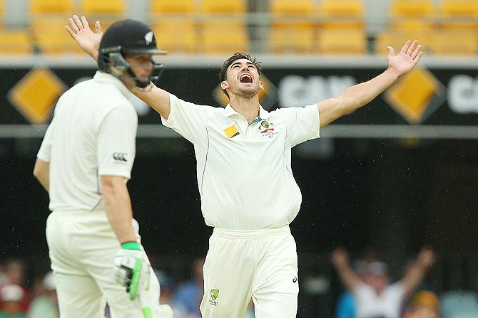 Australia's Mitchell Starc celebrates after dismissing New Zealand's Tom Latham