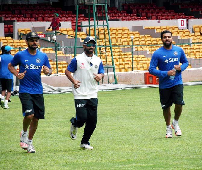 India captain Virat Kohli with teammates Ajinkya Rahane and Rohit Sharma