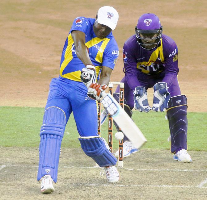 Brian Lara bats as Kumar Sangakkara looks on