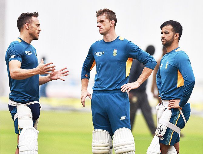 South Africa's Faf Du Plessis, Dane Vilas and J P Duminy have a discussion during a training session on Friday