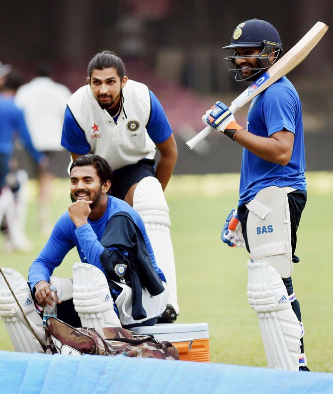 India's Ishant Sharma, Rohit Sharma and K L Rahul take a break during a training session at Chinnaswamy Stadium in Bengaluru on Friday