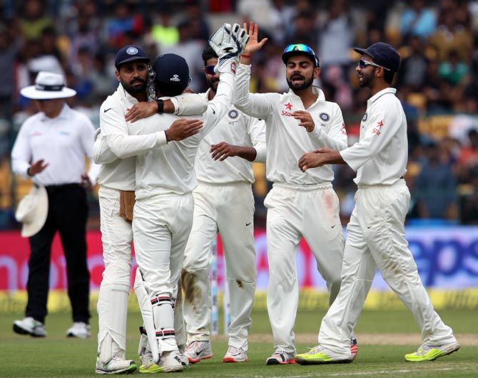 India players celebrate a wicket