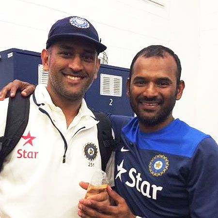 Mahendra Singh Dhoni with India's fielding coach R Sridhar