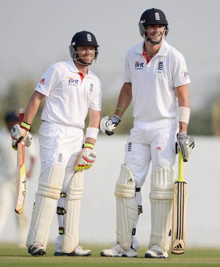 Kevin Pietersen and Ian Bell share a joke during the tour match between England and Haryana at Sardar Patel Stadium ground B on November 8, 2012 in Ahmedabad, India.