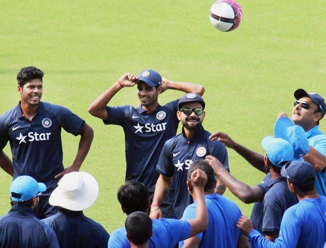  Virat Kohli, centre, Team India Director Ravi Shastri, right, and other players at a practice session